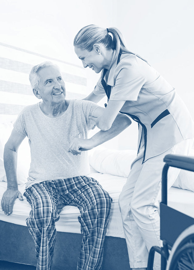 caregiver assisting a senior man getting up from his bed